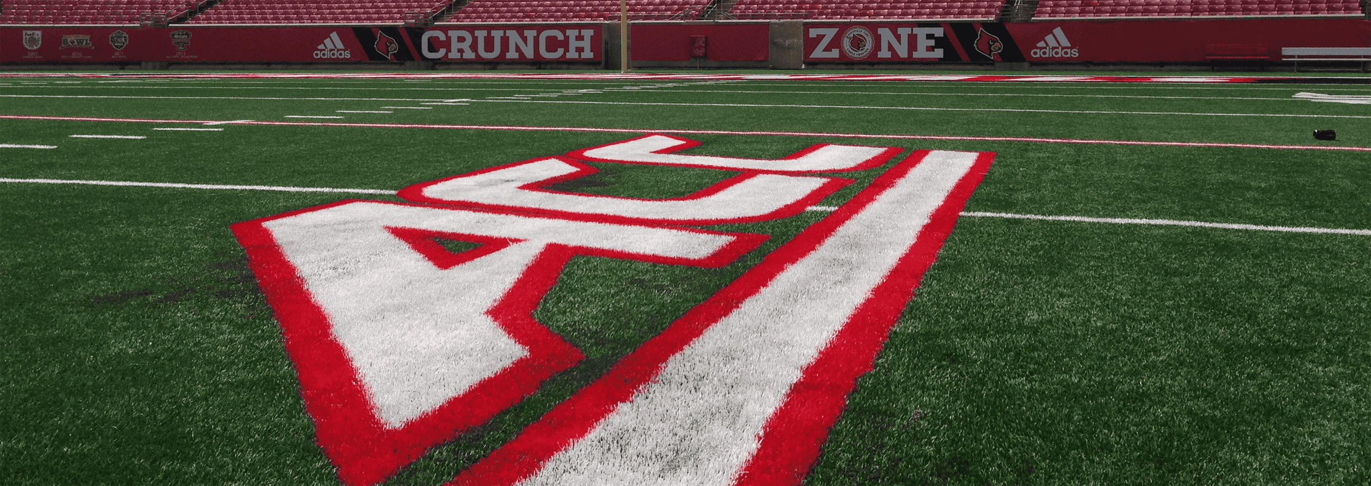 ACC Logo on Field at Papa John's Cardinal Stadium Summer 2014 Photo by Mark Blankenbaker Fitted