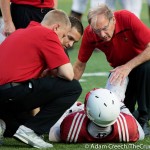 Trainers work on a fallen Cardinal during the 2015 Spring Game 4-17-2015 Photo by Adam Creech