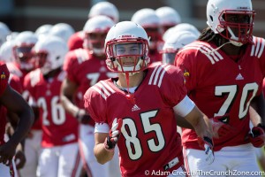Louisville Cardinals wide receiver Cody Swabek (85) participates in team stretches during an open practice on August 11, 2015. Photo by Adam Creech