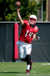 Louisville Cardinals quarterback Kyle Bolin (14) throws a pass during an open practice on August 11, 2015. Photo by Adam Creech