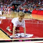 Young fan cleaning floor, mopping floor Louisville vs. Albany12-20-2017 Photo by William Caudill TheCrunchZone.com