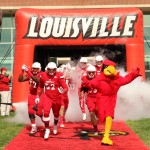 Lukayus McNeil, Nick Dawson-Brents, Micky Crum, Louie the Cardinal Entrance Louisville vs. Syracuse 11-7-2015 Photo by William Caudill