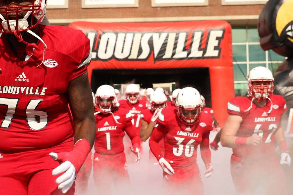 Kelby Johnson, T.C. Klusman, Kevin Houchins, Keith Brown Entrance Louisville vs. Syracuse 11-7-2015 Photo by William Caudill
