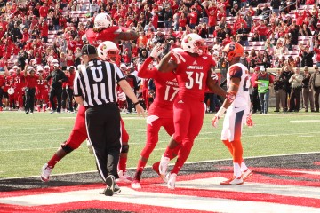 Jeremy Smith TD with James Quick, Lukayus McNeil Louisville vs. Syracuse 11-7-2015 Photo by William Caudill