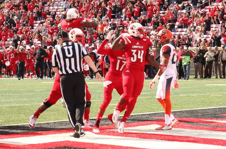 Jeremy Smith TD with James Quick, Lukayus McNeil Louisville vs. Syracuse 11-7-2015 Photo by William Caudill