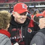 Bobby Petrino (with mom and dad) Louisville vs. Texas A&M 2015 Music City Bowl 12-30-2015 Photo by William Caudill