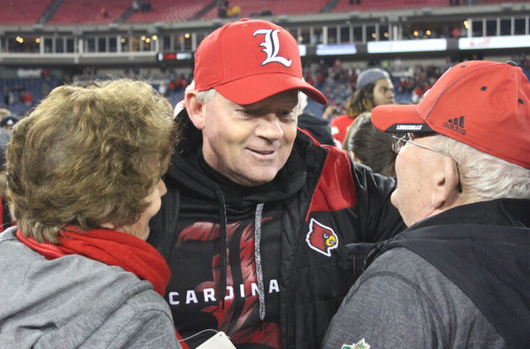 Bobby Petrino (with mom and dad) Louisville vs. Texas A&M 2015 Music City Bowl 12-30-2015 Photo by William Caudill