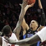 Duke’s Jayson Tatum, right, shooting over Louisville’s Jaylen Johnson, left, in the first half of their game during round 3 of the 2017 New York Life ACC Tournament at Barclays Center in Brooklyn, N.Y., Thursday, March 9, 2017. (Photo by Kevin Larkin, theACC.com)