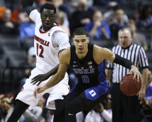 Duke forward Jayson Tatum (0) looks to move past Louisville forward Mangok Mathiang (12) during the quarterfinals of the 2017 New York Life ACC Tournament at the Barclays Center in Brooklyn, N.Y., Thursday, March 9, 2017. (Photo by David Welker, theACC.com)