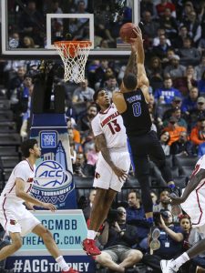 Duke forward Jayson Tatum (0) attempts to lay in a shot over Louisville forward Ray Spalding (13) during the quarterfinals of the 2017 New York Life ACC Tournament at the Barclays Center in Brooklyn, N.Y., Thursday, March 9, 2017. (Photo by David Welker, theACC.com)