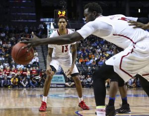 Louisville forward Ray Spalding (13) passes the ball to Louisville forward Mangok Mathiang (12) during the quarterfinals of the 2017 New York Life ACC Tournament at the Barclays Center in Brooklyn, N.Y., Thursday, March 9, 2017. (Photo by David Welker, theACC.com)